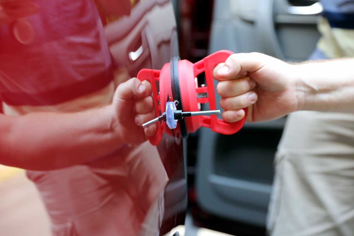 paintless dent repair photo from Adobe Stock